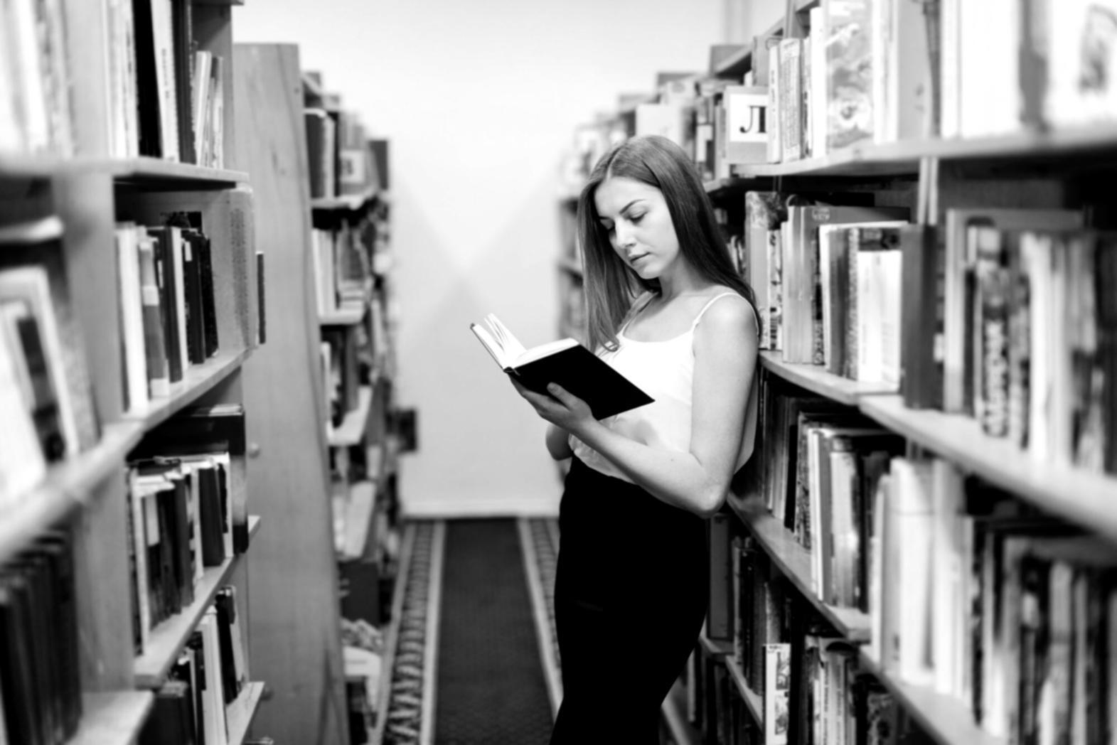 Multiple financial documents spread across a desk with analytical tools